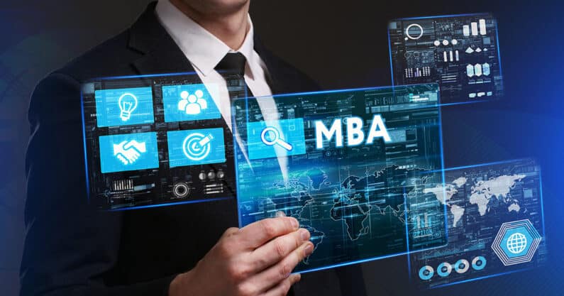 Businessman holding up MBA graphics